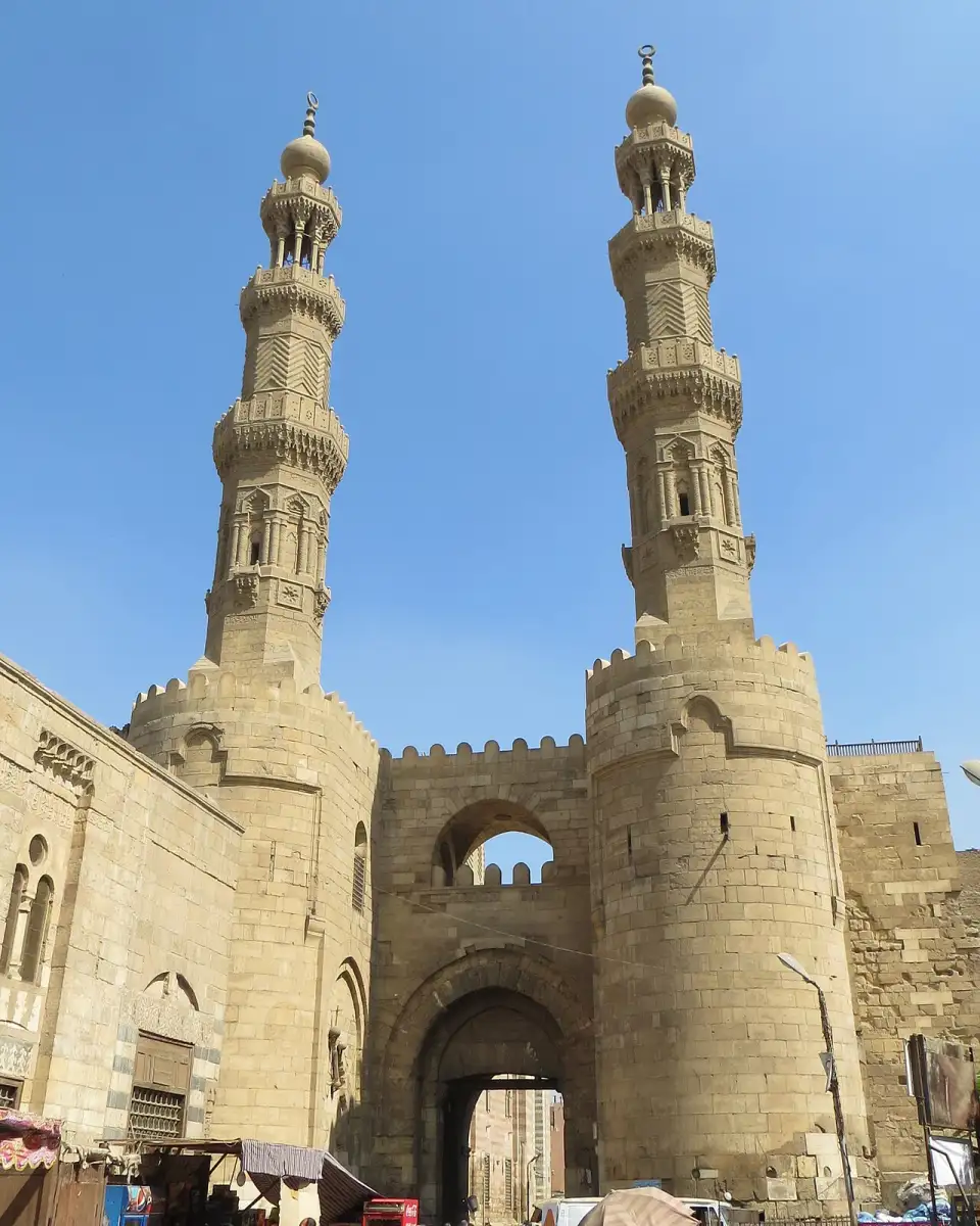 Bab Zuwayla with its two rounded towers and the twin minarets of the Mosque of al-Muayyad