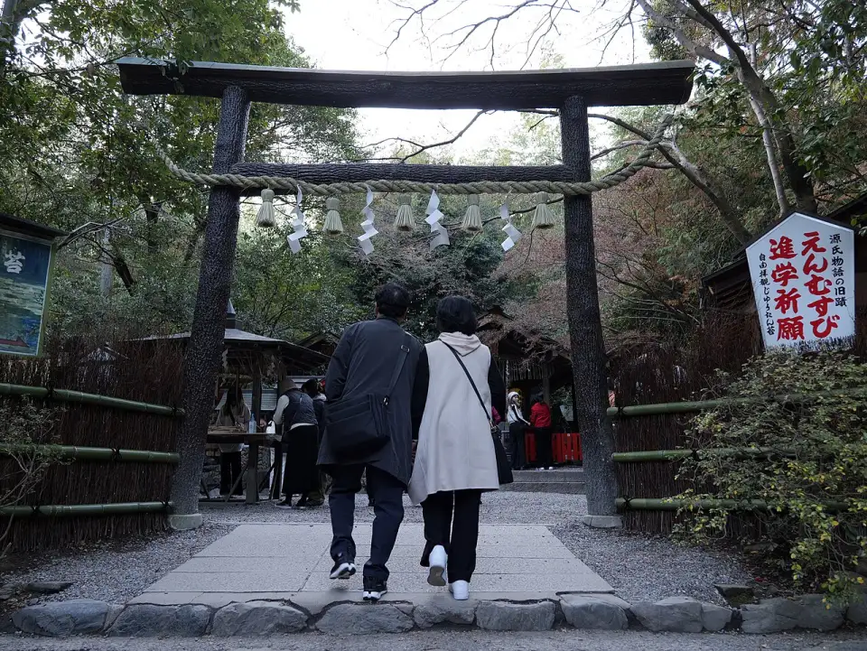 The bark-covered wooden torii of Nonomiya Shrine, with a sacred rope