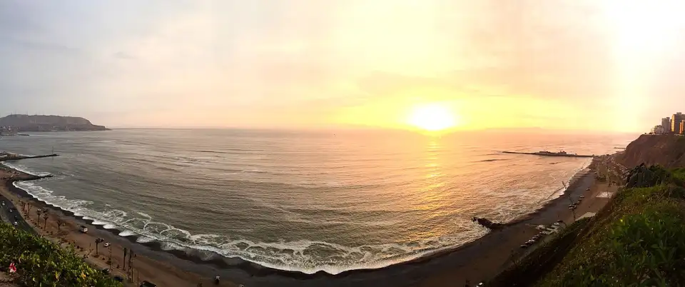 Sunset over Lima's Costa Verde from the Miraflores clifftop promenade