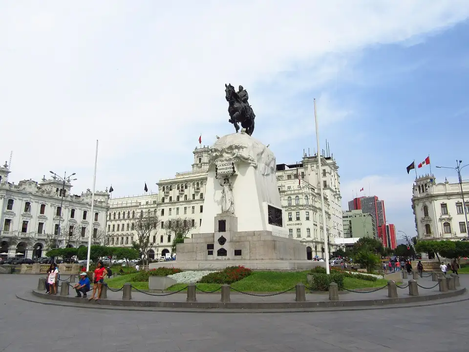Equestrian monument to San Martín in the middle of Lima's Plaza San Martín, surrounded by white buildings