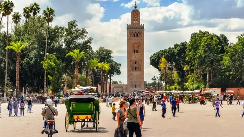 Jemaa el-Fna square by day with the Koutoubia minaret in the background