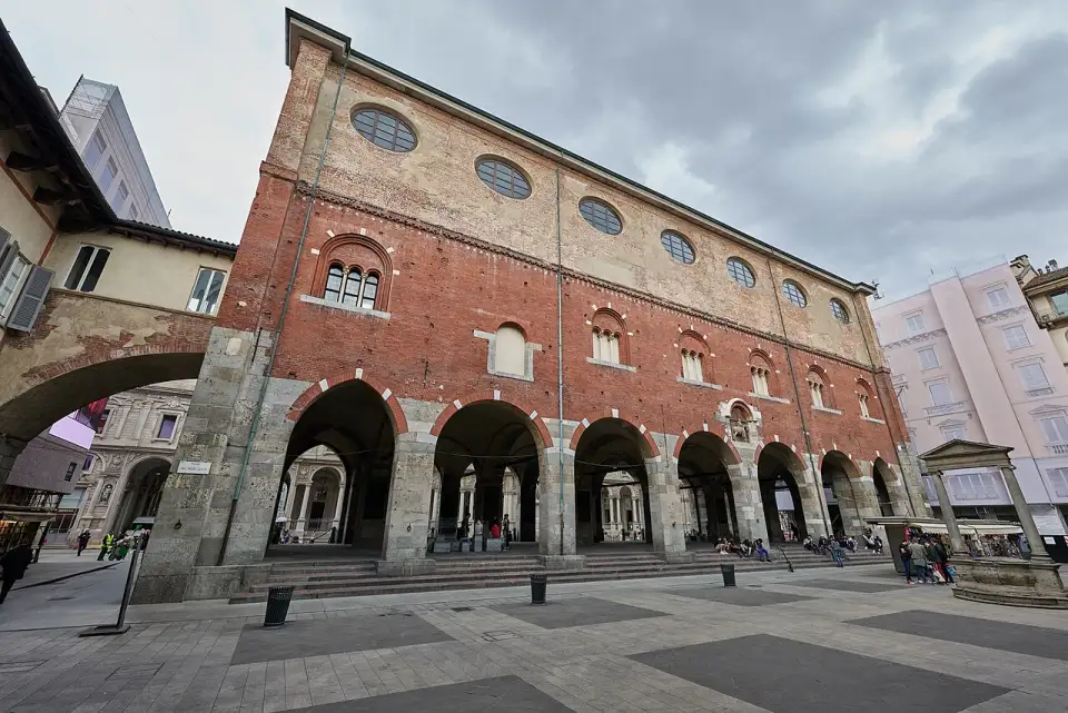 Red brick Palazzo della Ragione with its arcades on Piazza dei Mercanti