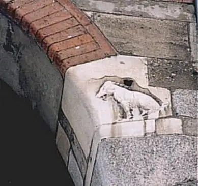 Medieval relief of the half-woolly sow on an arch of Palazzo della Ragione