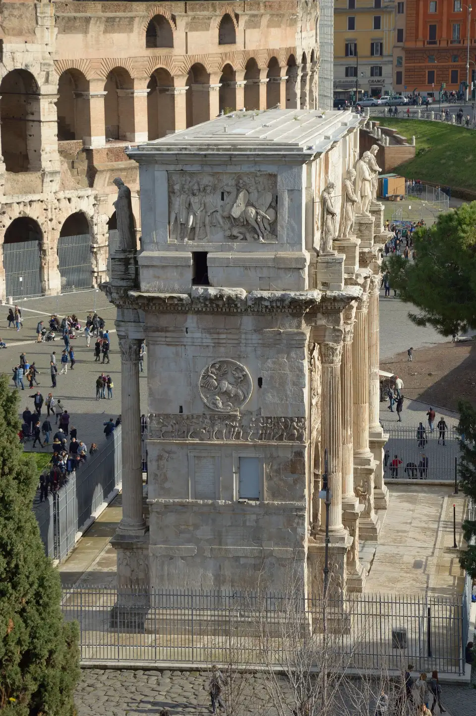 Side view of the Arch of Constantine next to the Colosseum