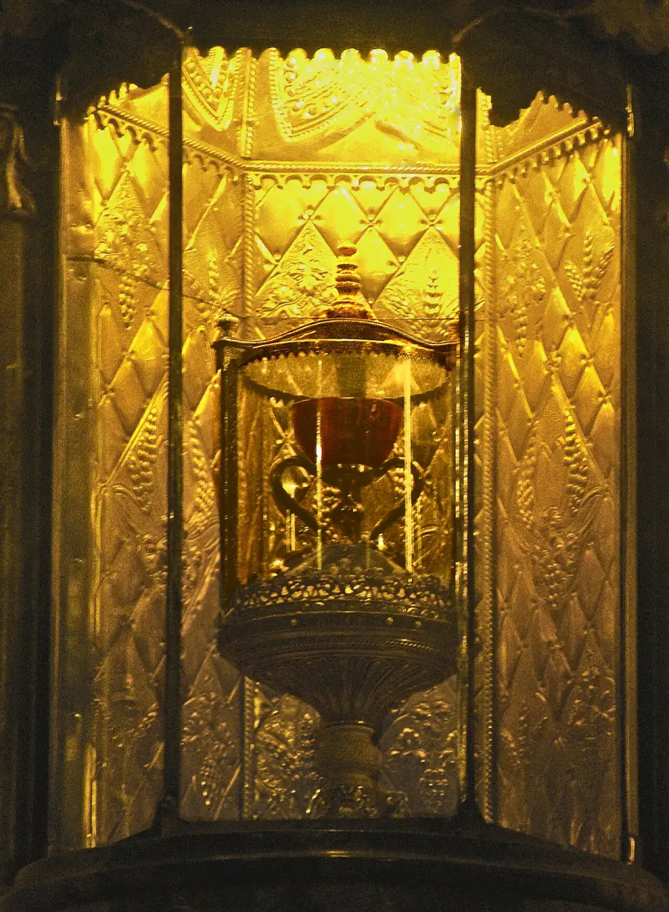 The Holy Chalice of Valencia, a reddish stone cup with gold handles and base